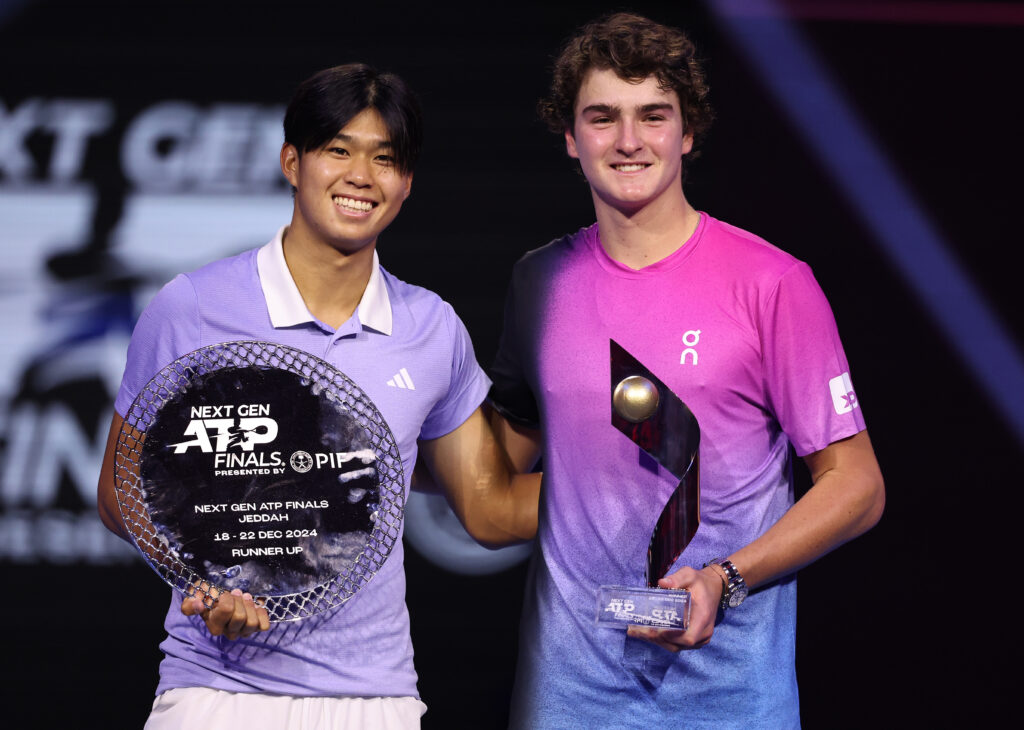 Learner Tien of USA , runner up and Joao Fonseca of Brazil ,winner, pose for a photo with their trophies after the Men's Final match on day five of the Next Gen ATP Finals presented by PIF at King Abdullah Sports City on December 22, 2024 in Jeddah, Saudi Arabia.