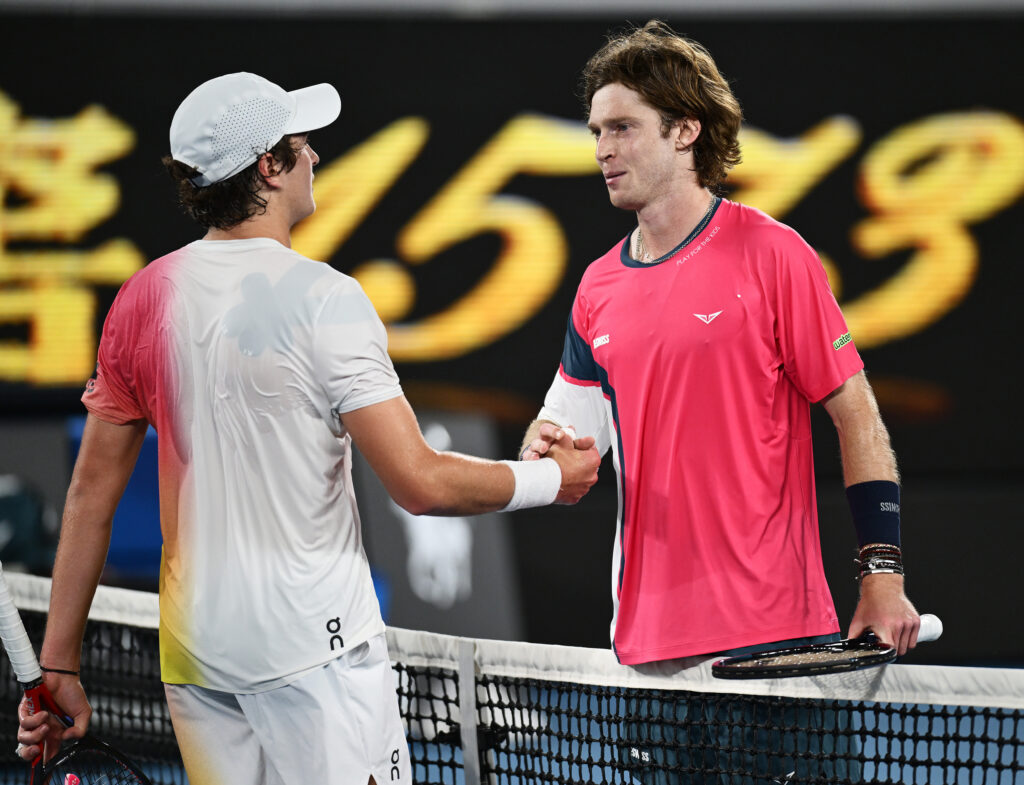 Joao Fonseca of Brazil shakes hands with Andrey Rublev following victory in the Men's Singles First Round match during day three of the 2025 Australian Open at Melbourne Park on January 14, 2025 in Melbourne, Australia.