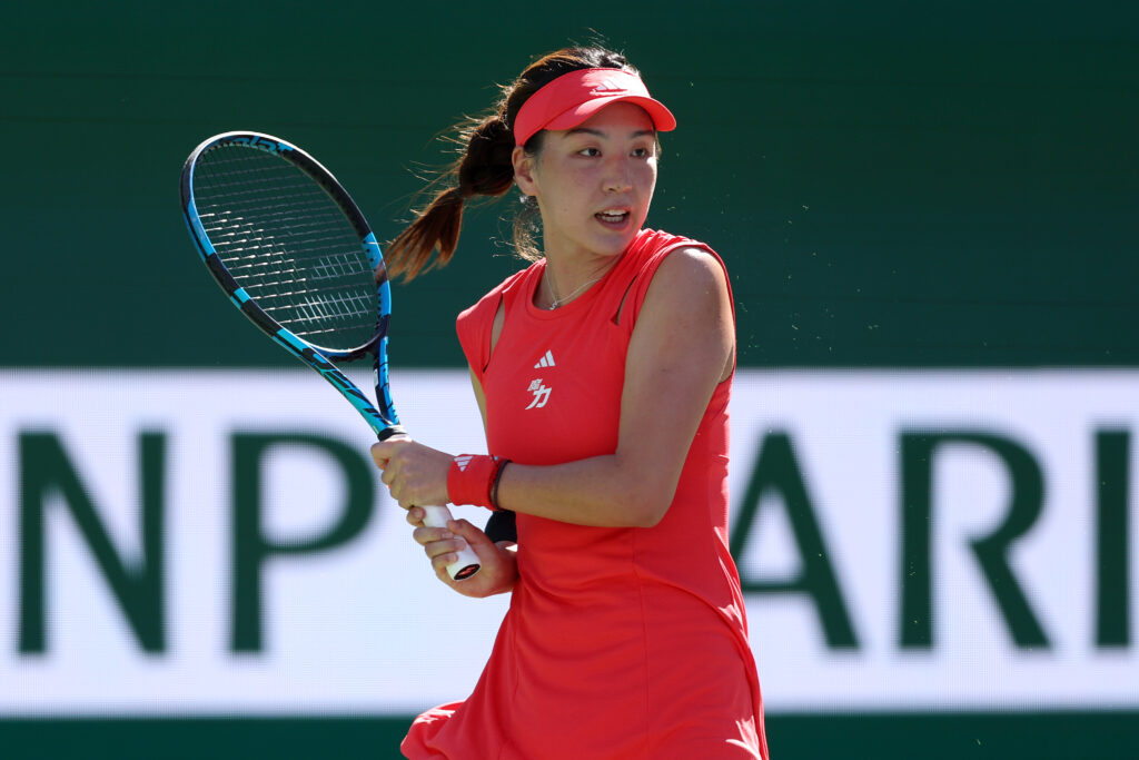 Xinyu Wang of China returns a shot to Jessica Pegula during the BNP Paribas Open at Indian Wells Tennis Garden on March 09, 2025 in Indian Wells, California.