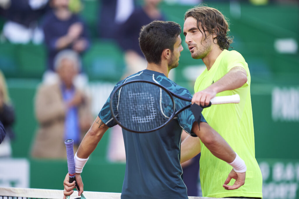 Lorenzo Musetti of Italy embraces Stefanos Tsitsipas of Greece in the Men's Singles Quarterfinals Match during day six of the Rolex Monte-Carlo Masters at Monte-Carlo Country Club on April 11, 2025 in Monte-Carlo, Monaco.