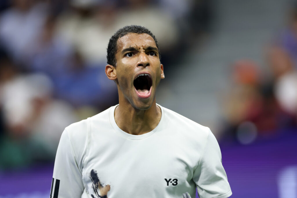 Felix Auger-Aliassime of Canada celebrates a point against Jannik Sinner of Italy during their Men's Semifinal match on Day Thirteen of the 2025 US Open at USTA Billie Jean King National Tennis Center on September 5, 2025 in the Flushing neighborhood of the Queens borough of New York City.