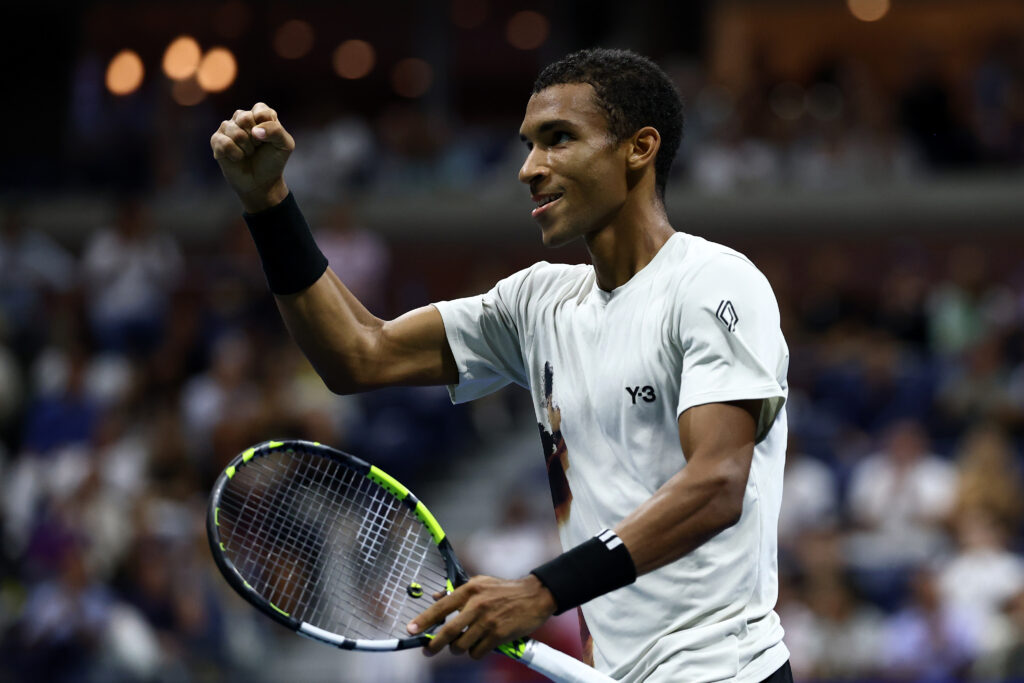 Felix Auger-Aliassime of Canada celebrates after winning the second set against Jannik Sinner of Italy during their Men's Semifinal match on Day Thirteen of the 2025 US Open at USTA Billie Jean King National Tennis Center on September 5, 2025 in the Flushing neighborhood of the Queens borough of New York City.