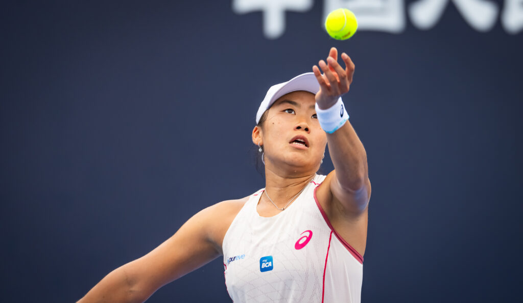 Janice Tjen of Indonesia in action against Viktoriya Tomova of Bulgaria in the second qualifications round on Day 2 of the China Open at National Tennis Center on September 23, 2025 in Beijing, China