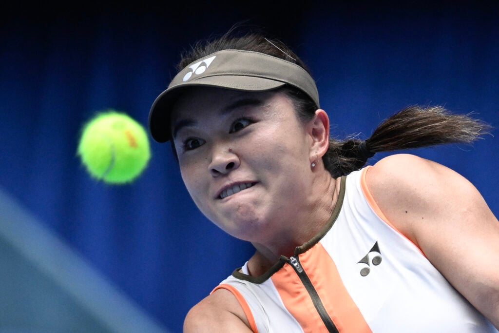 China's Zhu Lin hits a return to Japan's Moyuka Uchijima during their women's single match at the China Open tennis tournament in Beijing on September 25, 2025.