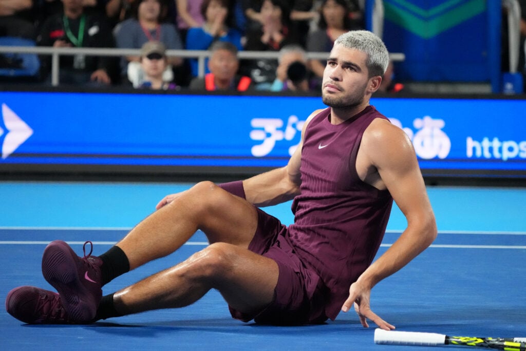 Carlos Alcaraz of Spain reacts after falling against Sebastian Baez of Argentina during the Singles Round of 32 on day two of Kinoshita Group Japan Open at Ariake Colosseum on September 25, 2025 in Tokyo, Japan.