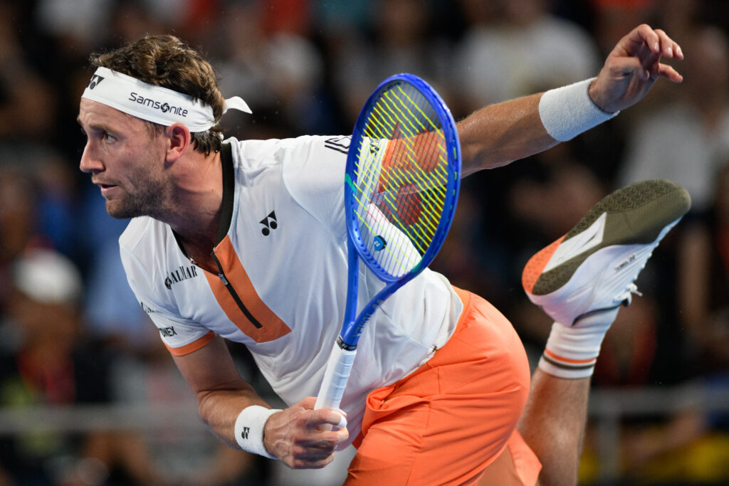 Norway's Casper Ruud serves against Spain's Carlos Alcaraz during their men's singles match at the ATP Japan Open tennis tournament in Tokyo on September 29, 2025.