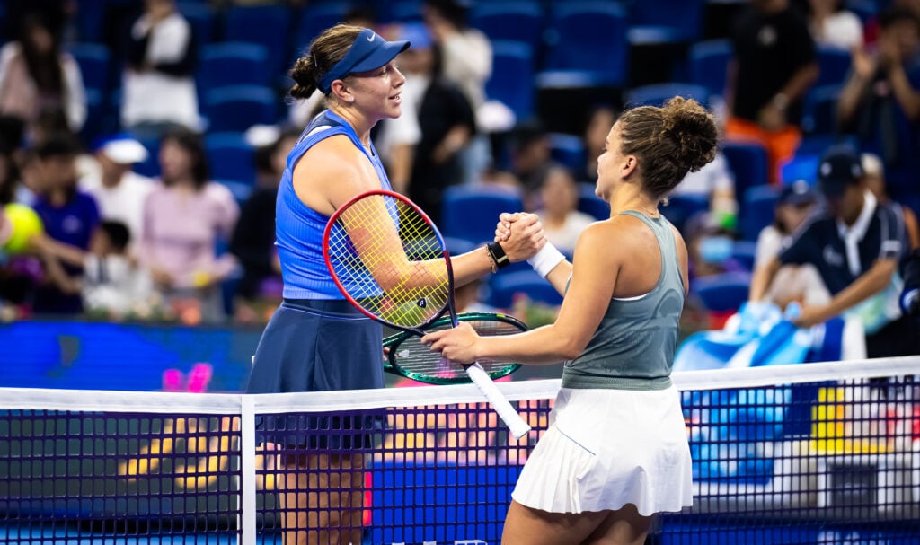 Amanda Anisimova of the United States and Jasmine Paolini of Italy shake hands at the net after the quarter-final on Day 11 of the China Open at National Tennis Center on October 02, 2025 in Beijing, China