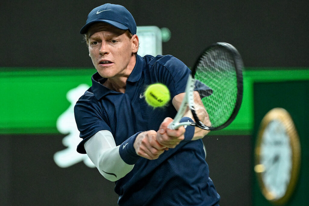 Italy's Jannik Sinner hits a return to Germany's Daniel Altmaier during their men's singles match at the Shanghai Masters tennis tournament in Shanghai on October 4, 2025.
