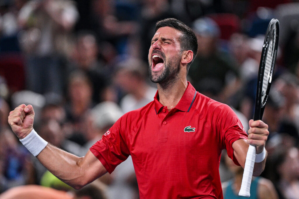 Serbia's Novak Djokovic celebrates after winning against Germany's Yannick Hanfmann during their men's singles match at the Shanghai Masters tennis tournament in Shanghai on October 5, 2025.