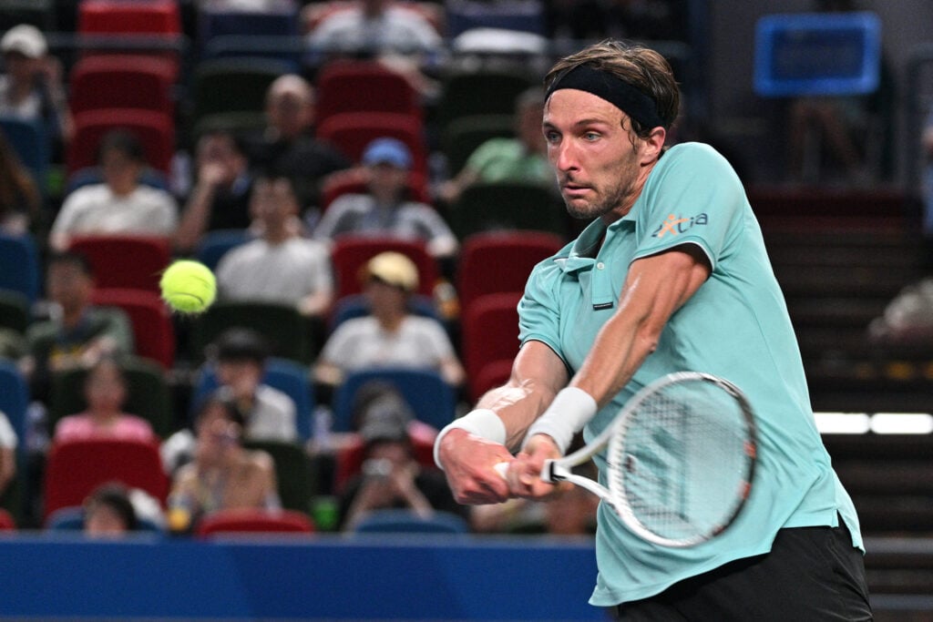 France's Arthur Rinderknech hits a return against Germany's Alexander Zverev in their men's singles match at the Shanghai Masters tennis tournament in Shanghai on October 6, 2025.