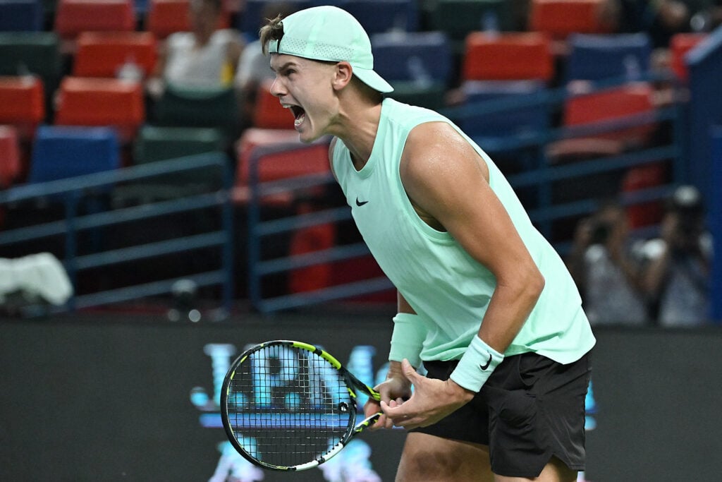 Denmark's Holger Rune celebrates after victory against France's Giovanni Mpetshi Perricard during their men's singles match at the Shanghai Masters tennis tournament in Shanghai on October 7, 2025.