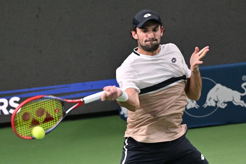Monaco's Valentin Vacherot hits a return to Netherlands' Tallon Griekspoor during their men's singles match at the Shanghai Masters tennis tournament in Shanghai on October 7, 2025.