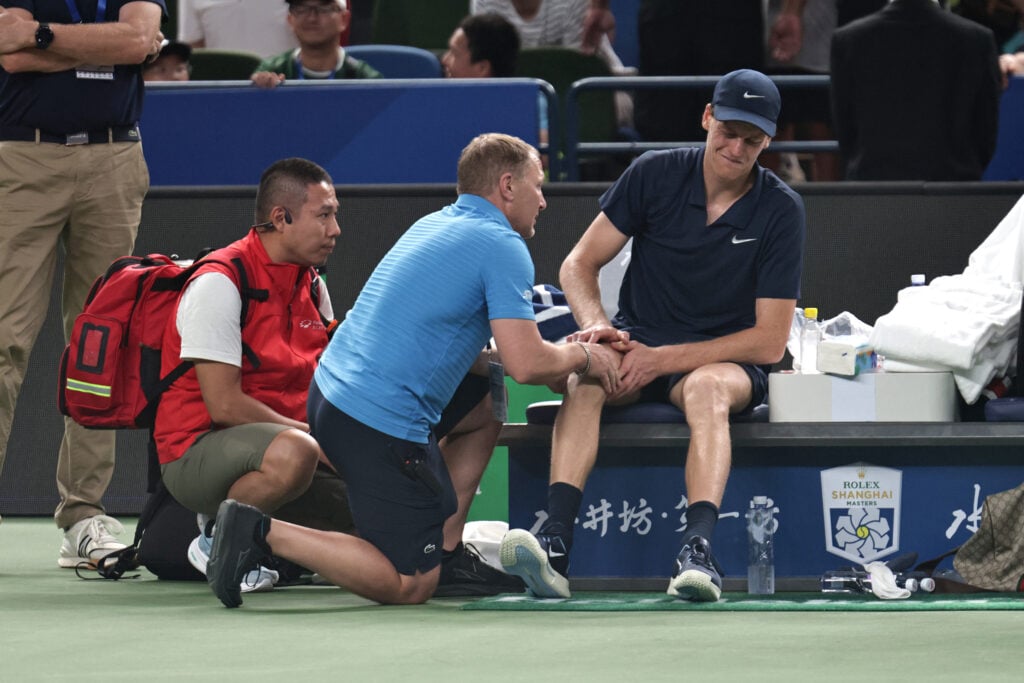 Jannik Sinner of Italy withdraws due to injury during the match against Tallon Griekspoor of Netherlands in the Men's Singles 3rd round match on day 7 of the 2025 Shanghai Rolex Masters Qi Zhong Tennis Center on October 05, 2025 in Shanghai, China.