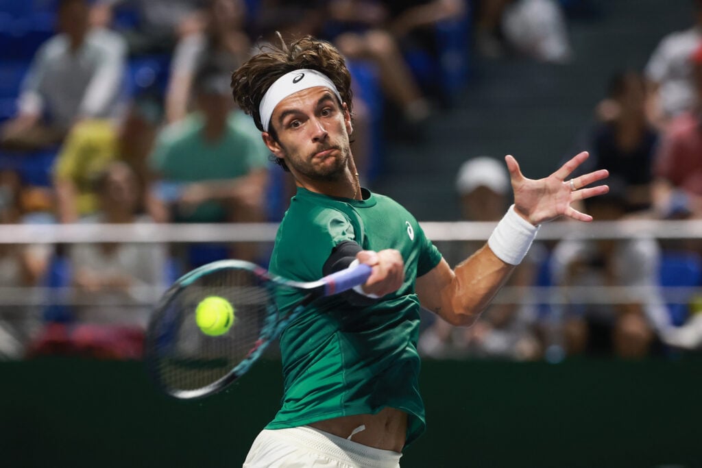 Lorenzo Musetti of Italy returns a shot against Luciano Darderi of Italy in the Men's singles round of 32 on Day 8 of 2025 Shanghai Rolex Masters at Qi Zhong Tennis Center on October 06, 2025 in Shanghai, China.