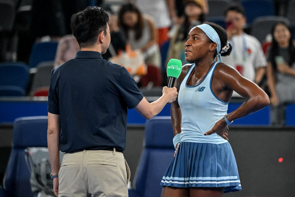 USA's Coco Gauff (R) speaks during an interview after winning against China's Zhang Shuai in their women's singles match at the Wuhan Open tennis tournament in Wuhan, Central China's Hubei province on October 9, 2025.