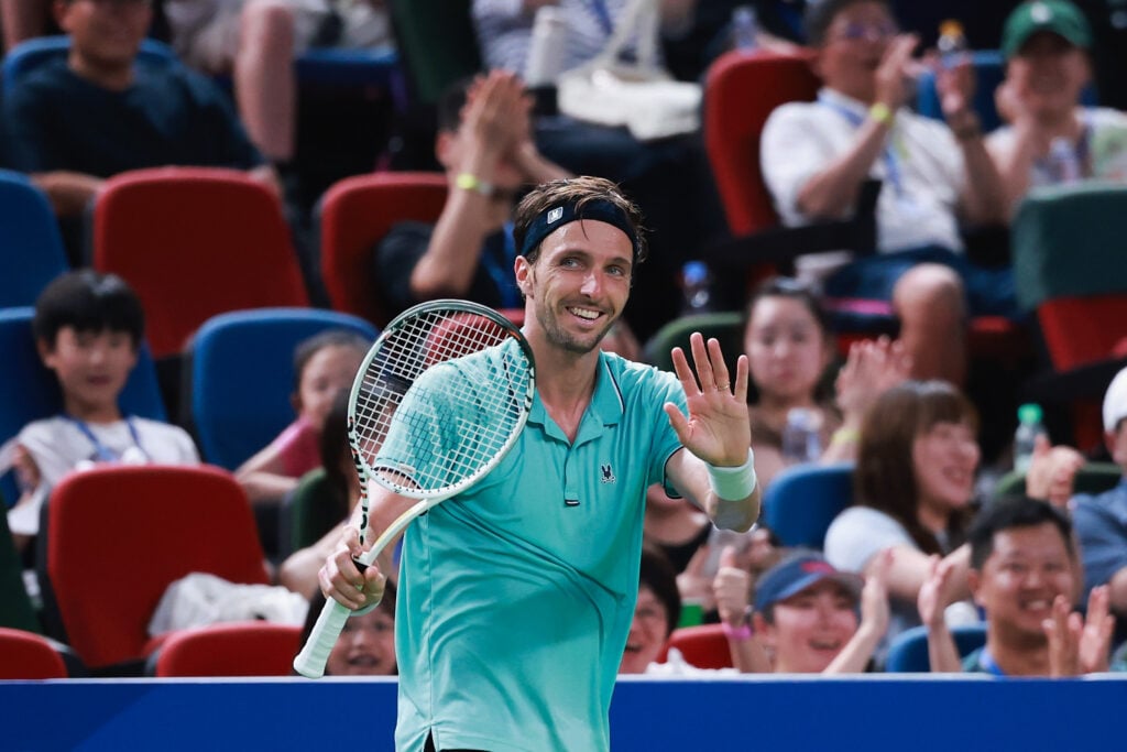 Arthur Rinderknech of France returns a shot against Alexander Zverev of Germany in the Men's singles round of 32 match on Day 8 of 2025 Shanghai Rolex Masters at Qi Zhong Tennis Center on October 06, 2025 in Shanghai, China.
