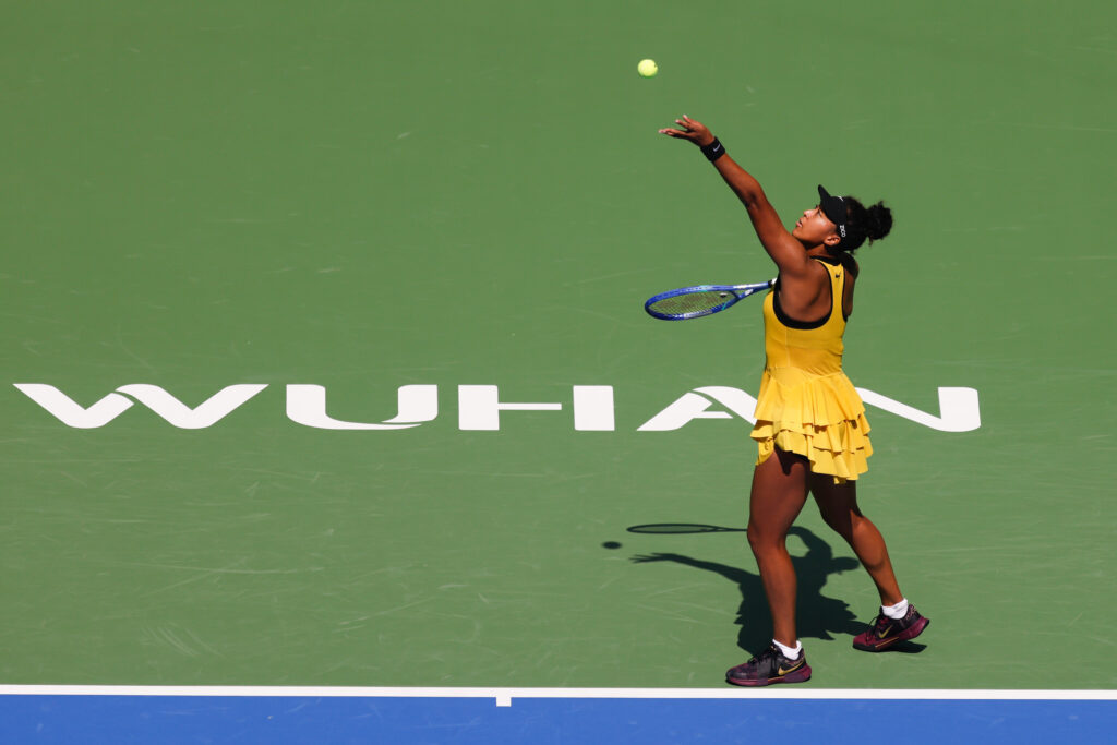 Naomi Osaka of Japan serves against Leylah Fernandez of Canada in the women's singles round of 64 match during day four of the 2025 Wuhan Open at Optics Valley International Tennis Center on October 7, 2025 in Wuhan, China.
