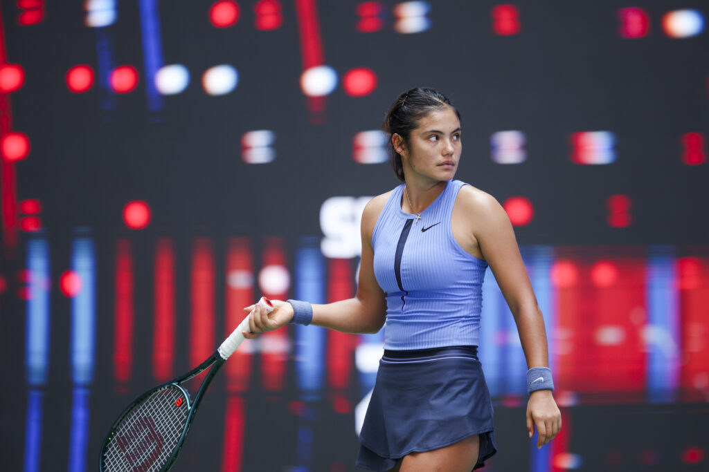 Emma Raducanu of Great Britain reacts in the Women's Singles Round of 64 match against Ann Li of United States on day 4 of 2025 Wuhan Open at Optics Valley International Tennis Center on October 7, 2025 in Wuhan, Hubei Province of China.