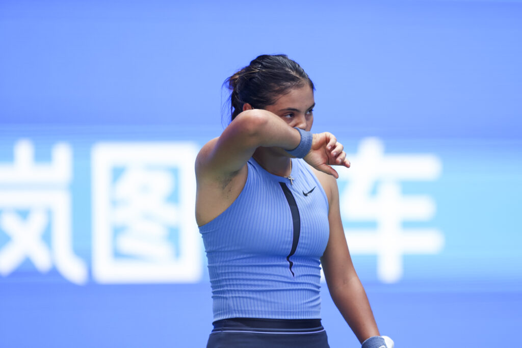 Emma Raducanu of Great Britain reacts in the Women's Singles Round of 64 match against Ann Li of United States on day 4 of 2025 Wuhan Open at Optics Valley International Tennis Center on October 7, 2025 in Wuhan, Hubei Province of China.