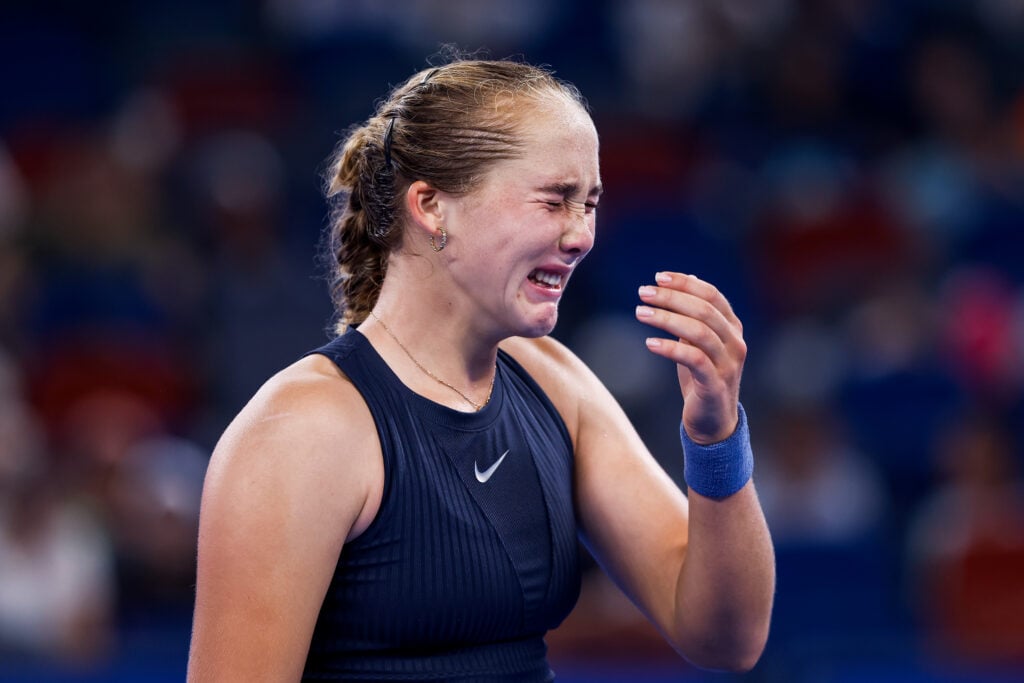 Mirra Andreeva reacts in the Women's Singles Round of 32 match against Laura Siegemund of Germany on Day 4 of the Wuhan Open at Optics Valley International Tennis Center on October 7, 2025 in Wuhan, China