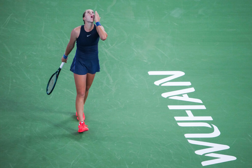 Mirra Andreeva reacts in the Women's Singles Round of 32 match against Laura Siegemund of Germany on Day 4 of the Wuhan Open at Optics Valley International Tennis Center on October 7, 2025 in Wuhan, China.
