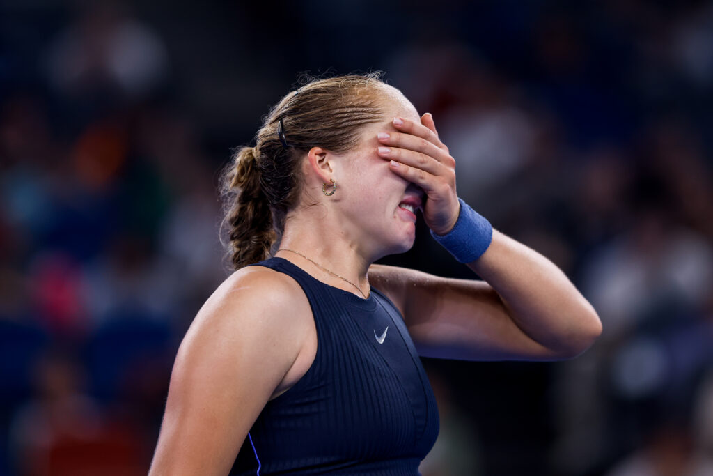 Mirra Andreeva reacts in the Women's Singles Round of 32 match against Laura Siegemund of Germany on Day 4 of the Wuhan Open at Optics Valley International Tennis Center on October 7, 2025 in Wuhan, China