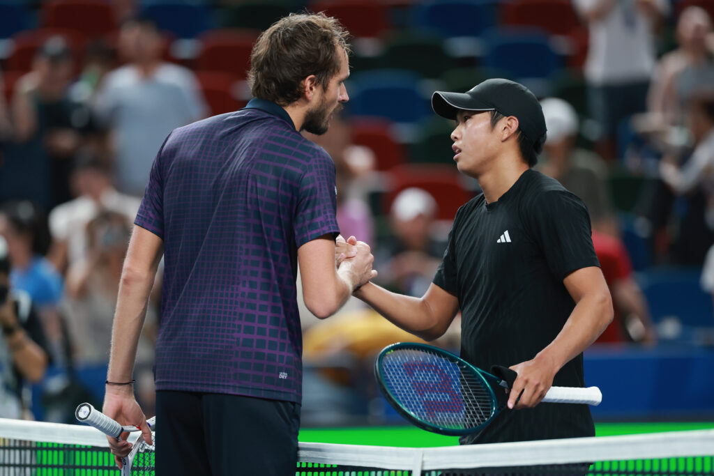 Daniil Medvedev shaking hands with Learner Tien of the United States in front net after his win the Men's singles round of 16 match on Day 10 of 2025 Shanghai Rolex Masters at Qi Zhong Tennis Center on October 08, 2025 in Shanghai, China.