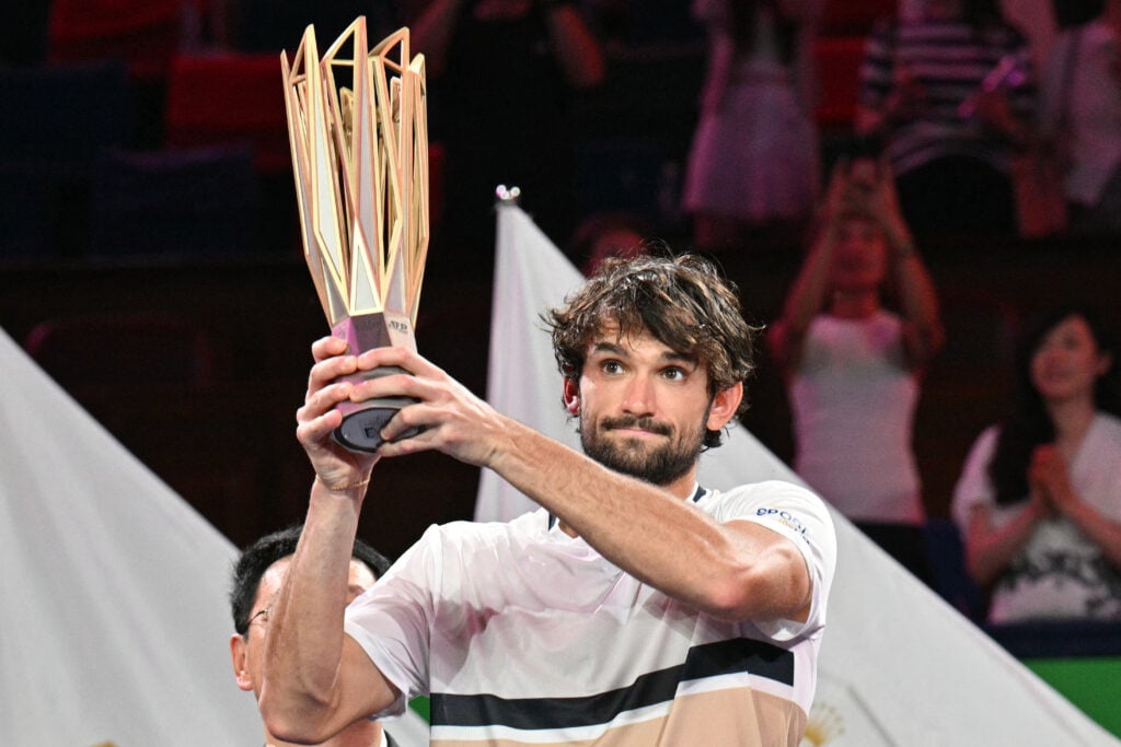 Monaco's Valentin Vacherot holds up the trophy after his victory against France's Arthur Rinderknech during the men's singles final at the Shanghai Masters tennis tournament in Shanghai on October 12, 2025.
