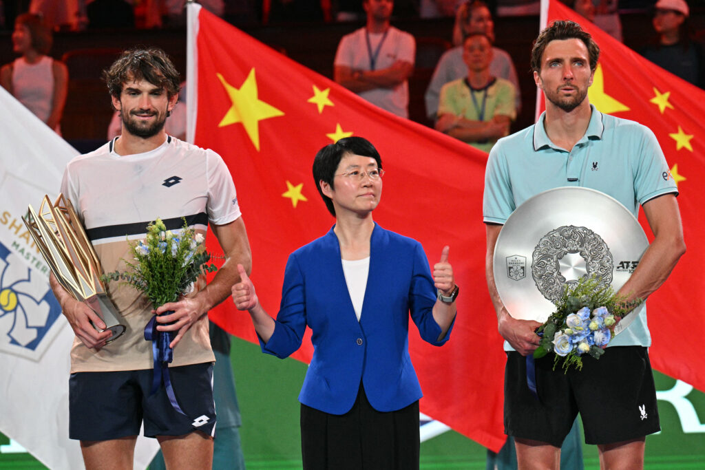 Monaco's Valentin Vacherot (L) poses with the trophy after his victory against France's Arthur Rinderknech (R) during the men's singles final at the Shanghai Masters tennis tournament in Shanghai on October 12, 2025.