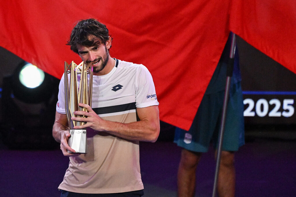 Monaco's Valentin Vacherot celebrates with the trophy after his victory against France's Arthur Rinderknech during the men's singles final at the Shanghai Masters tennis tournament in Shanghai on October 12, 2025.