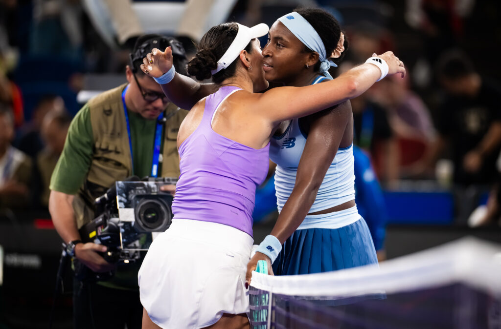 Jessica Pegula of the United States and Coco Gauff of the United States embrace at the net after the singles final on Day 9 of the Wuhan Open at Optics Valley International Tennis Center on October 12, 2025 in Wuhan, China