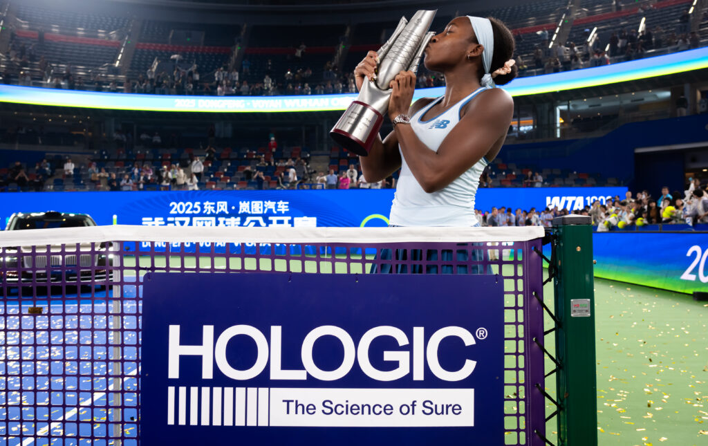 Coco Gauff of the United States poses with the champions trophy after defeating Jessica Pegula of the United States in the singles final on Day 9 of the Wuhan Open at Optics Valley International Tennis Center on October 12, 2025 in Wuhan, China