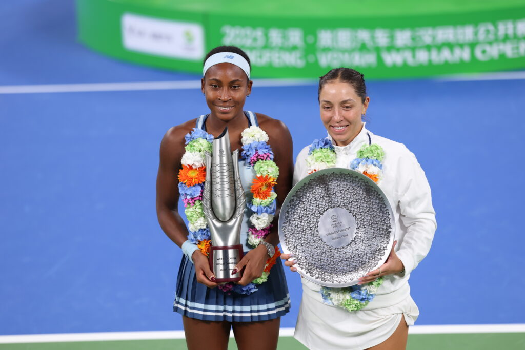 Champion Coco Gauff of the United States and runner-up Jessica Pegula of the United States pose with the trophies at the award ceremony following the Women's Singles Final match on day 9 of 2025 Wuhan Open at Optics Valley International Tennis Center on October 12, 2025 in Wuhan, Hubei Province of China.
