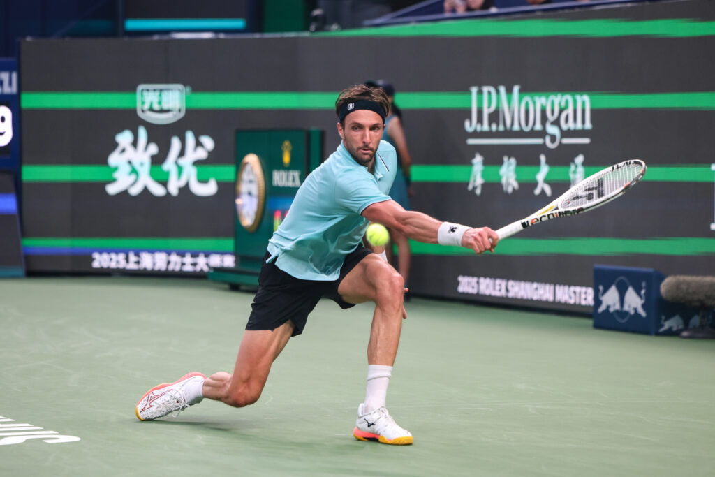 Arthur Rinderknech of France returns a shot in the Men's Singles Final match against Valentin Vacherot of Monaco on day 14 of the 2025 Shanghai Rolex Masters at Qi Zhong Tennis Center on October 12, 2025 in Shanghai, China.
