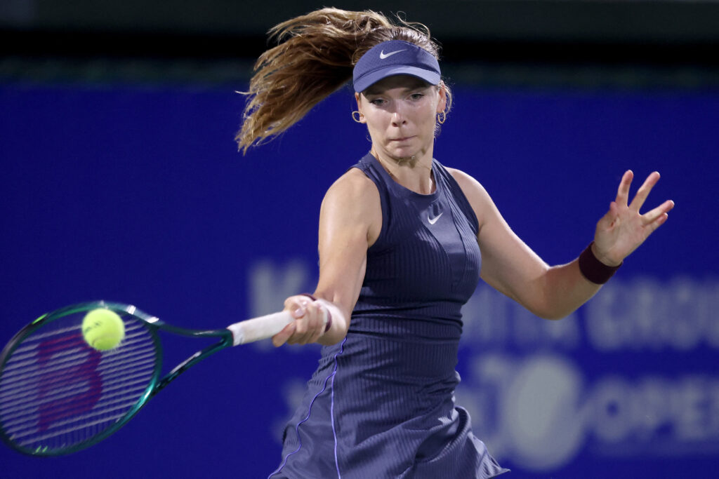 Britain's Katie Boulter hits a return to Romania's Sorana Cirstea during their women's singles match at the Japan Open tennis tournament in Osaka on October 15, 2025.