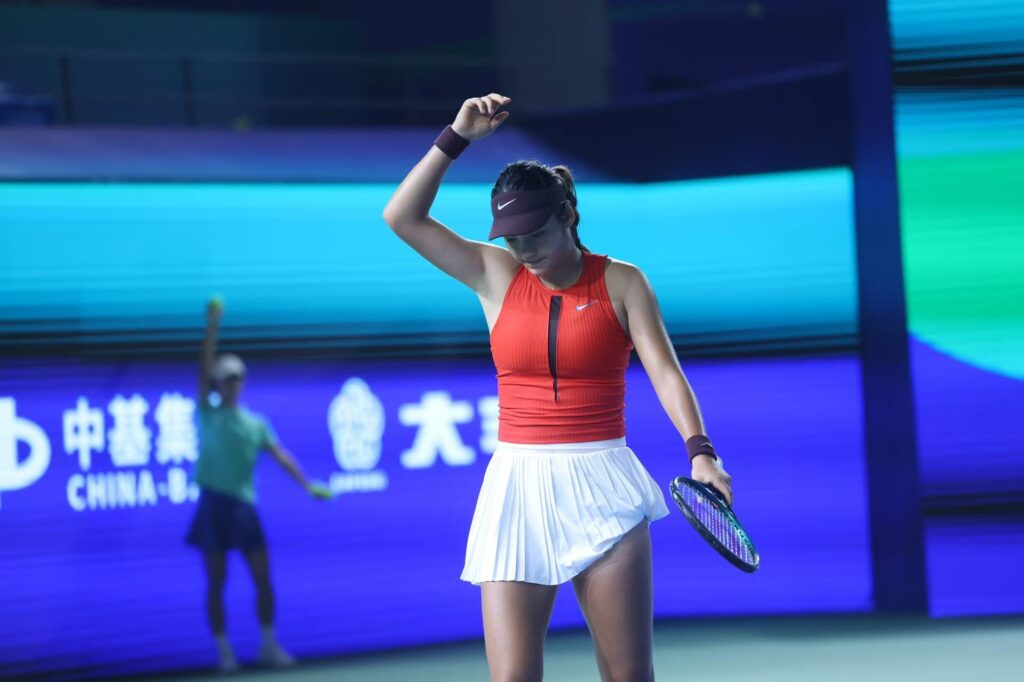 Emma Raducanu of Great Britain reacts in the Women's Singles Round of 32 match against Zhu Lin of China on day 2 of 2025 Ningbo Open at the Ningbo (Yinzhou) Tennis Center on October 14, 2025 in Ningbo, Zhejiang Province of China.