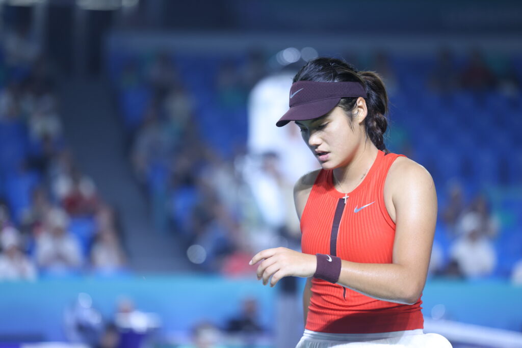 Emma Raducanu of Great Britain reacts in the Women's Singles Round of 32 match against Zhu Lin of China on day 2 of 2025 Ningbo Open at the Ningbo (Yinzhou) Tennis Center on October 14, 2025 in Ningbo, Zhejiang Province of China.