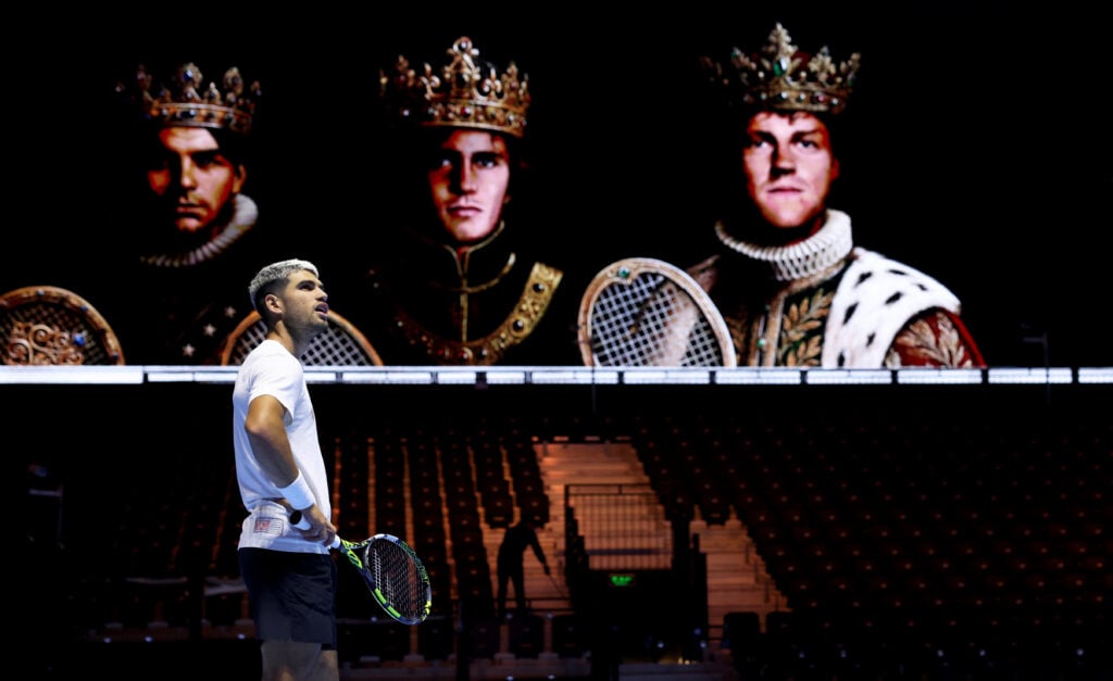 Carlos Alcaraz of Spain looks up away from a giant poster of some of the players in the tournament during a practice session on day one of the Six Kings Slam 2025 at ANB Arena on October 15, 2025 in Riyadh, Saudi Arabia.