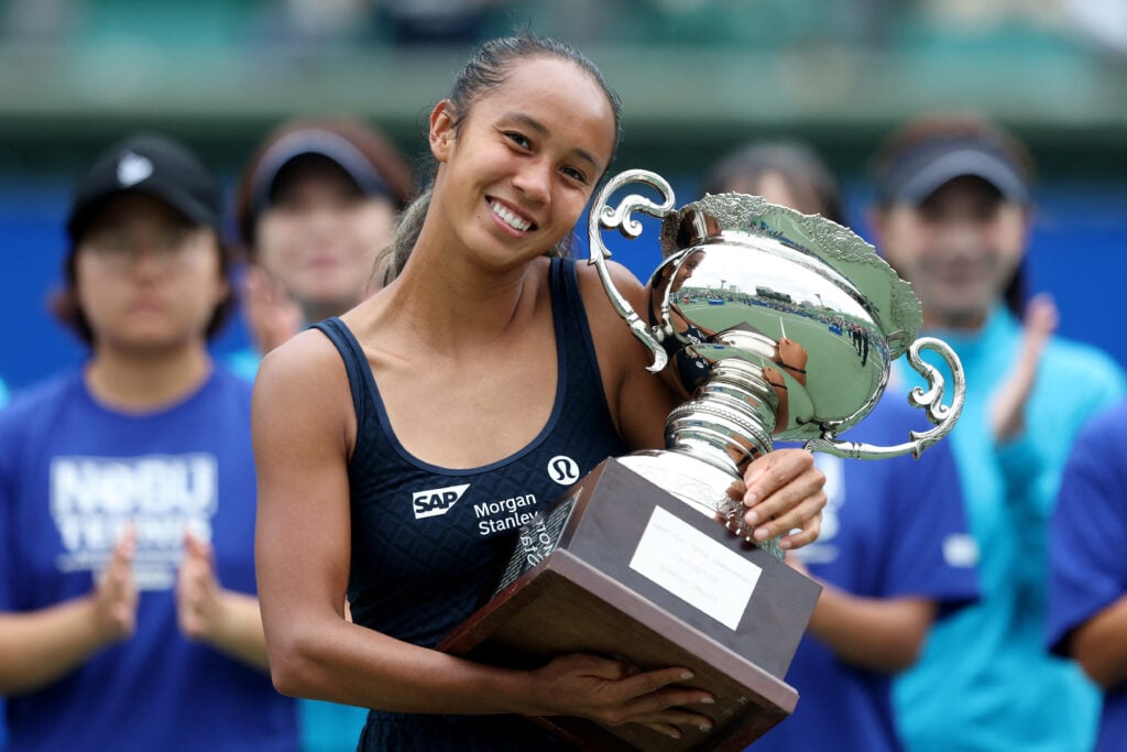Canada's Leylah Fernandez poses with the winner's trophy after defeating Czech Republic's Tereza Valentova in their women's singles final match at the Japan Open tennis tournament in Osaka on October 19, 2025.