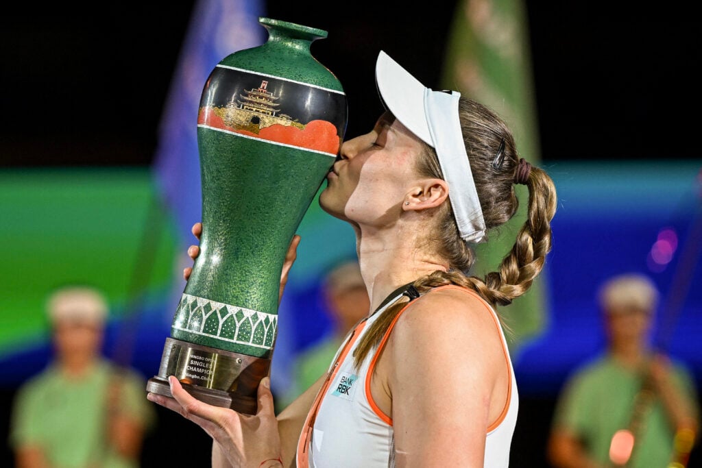 Kazakhstan's Elena Rybakina kisses the trophy after her victory against Russia's Ekaterina Alexandrova during their women's singles final match at the WTA Ningbo Open tennis tournament in Ningbo, in China's eastern Zhejiang province on October 19, 2025.