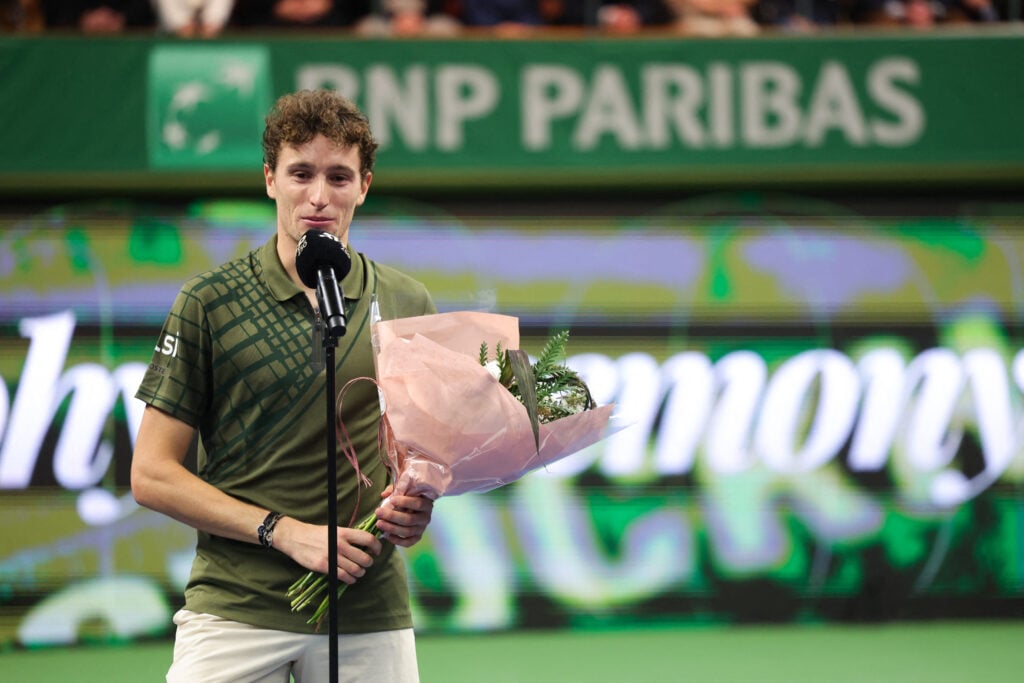 France's Ugo Humbert delivers a speech after his singles final match of the BNP Paribas Nordic Open tennis tournament against Norway's Casper Ruud (not in picture) at the Royal Swedish Tennis Hall in Stockholm, Sweden, on October 19, 2025.