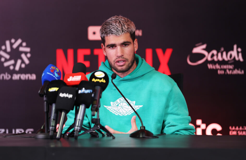 Carlos Alcaraz of Spain is interviewed by journalists in the press conference after his straight sets defeat by Jannik Sinner of Italy (not pictured) during the Men's Single's Final on day three of the Six Kings Slam 2025 at ANB Arena on October 18, 2025 in Riyadh, Saudi Arabia.
