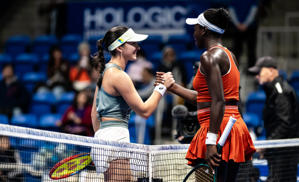 Eva Lys of Germany and Victoria Mboko of Canada shake hands after the second round on Day 3 of the Toray Pan Pacific Open at Ariake Coliseum on October 22, 2025 in Tokyo, Japan