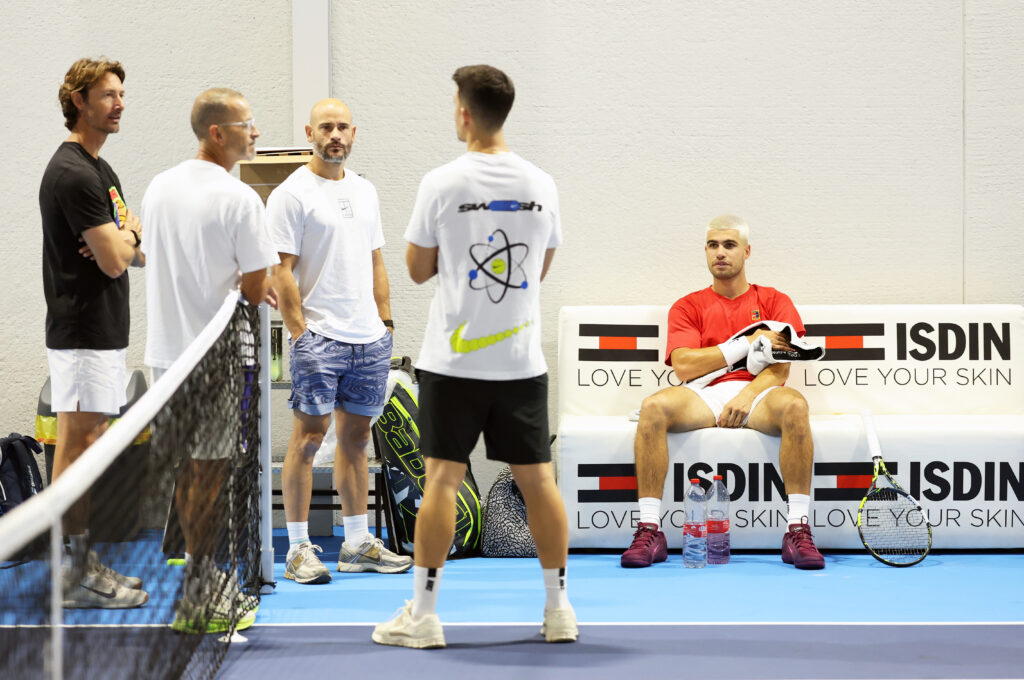 Carlos Alcaraz of Spain takes a break and talks to his team during a practice session at El Palmar prior to his final ATP Masters Series event of the year in Paris on October 22, 2025 in Murcia, Spain.