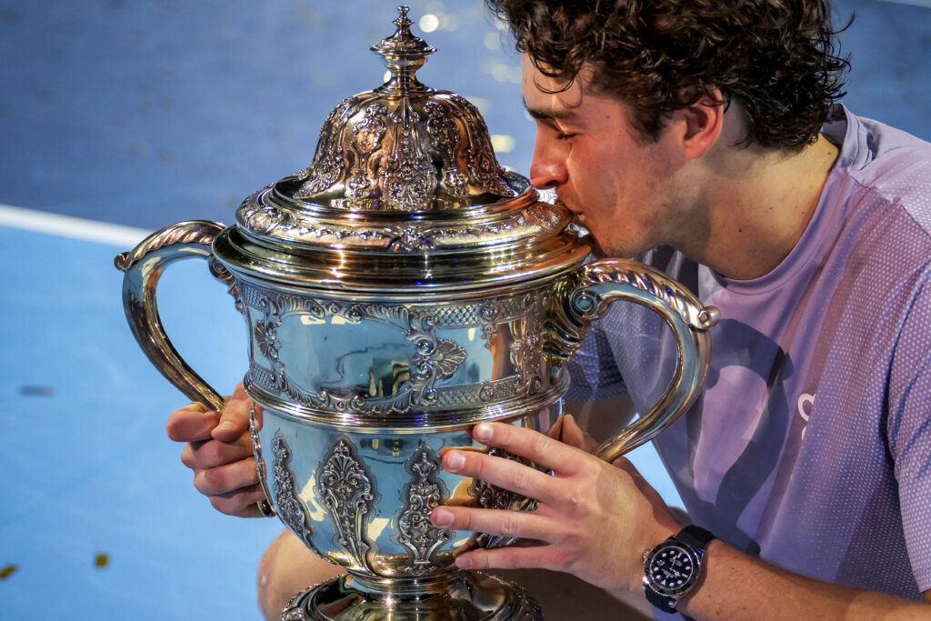 Brazil's Joao Fonseca kisses the trophy after winning against Spain's Alejandro Davidovich Fokina in their men's final match at the Swiss Indoors ATP 500 tennis tournament in Basel on October 26, 2025.
