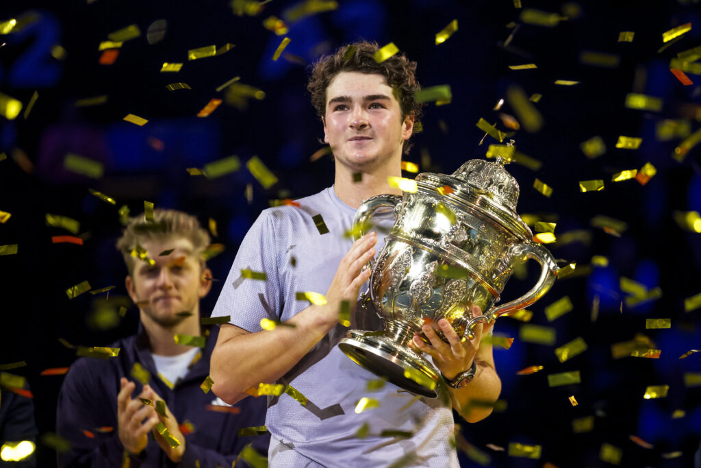 Brazil's Joao Fonseca poses with the trophy after winning against Spain's Alejandro Davidovich Fokina in their men's final match at the Swiss Indoors ATP 500 tennis tournament in Basel on October 26, 2025.