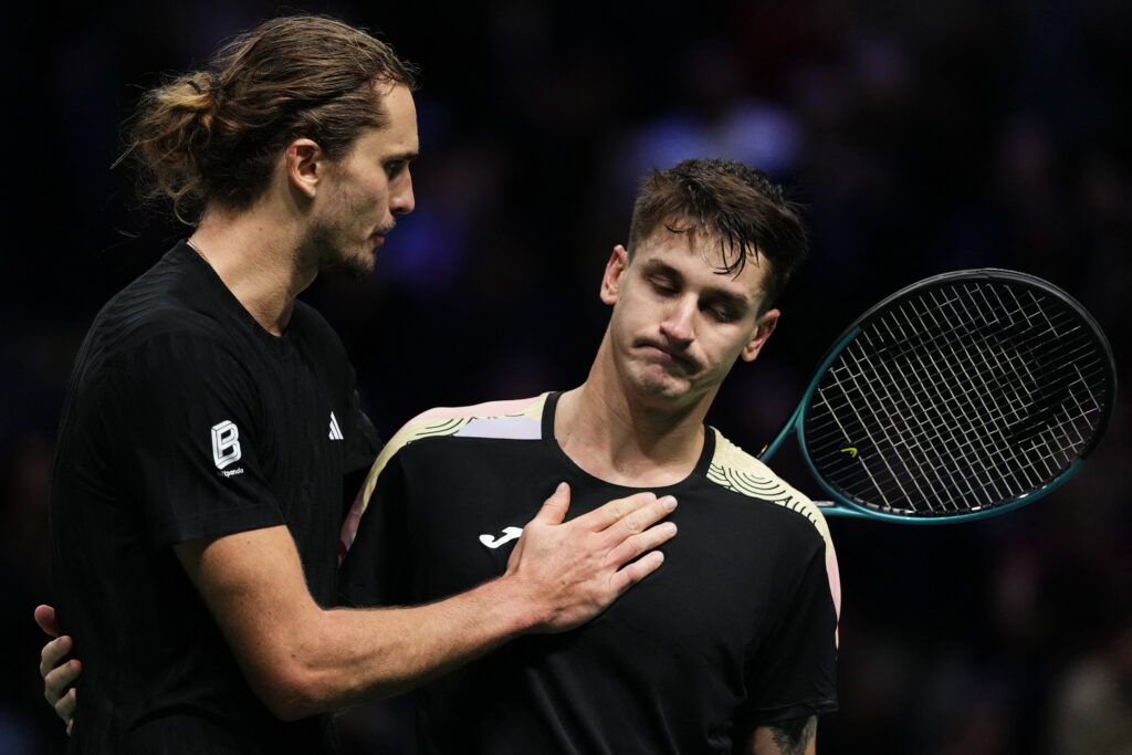 Winner Germany's Alexander Zverev cheers Argentine's Camilo Ugo Carabelli (R) following their men's singles match on day three of the Paris ATP Masters 1000 tennis tournament at the Paris La Défense Arena in Nanterre, on the outskirts of Paris, on October 29, 2025.