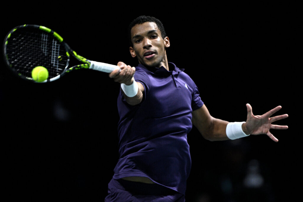 Canada's Felix Auger-Aliassime plays a forehand return to Germany's Daniel Altmaier during their men's singles match on day four of the Paris ATP Masters 1000 tennis tournament at the Paris La Défense Arena in Nanterre, on the outskirts of Paris, on October 30, 2025.