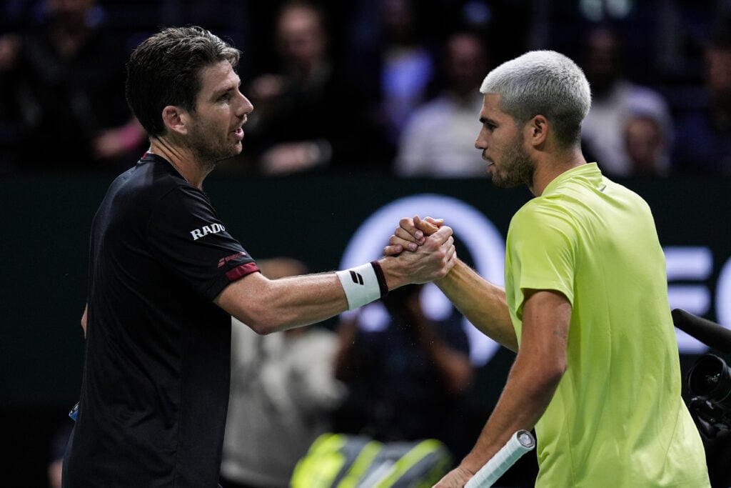 Cameron Norrie (L) of Great Britain greets Carlos Alcaraz of Spain after their Men's Singles First Round match during day two of the Rolex Paris Masters 2025 on October 28, 2025 in Nanterre, France.