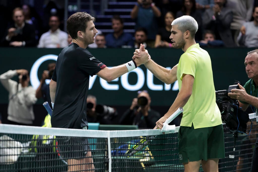 Cameron Norrie of Great Britain greets Carlos Alcaraz of Spain at the net after his first round victory on day two of the Rolex Paris Masters 2025, an ATP 1000 tennis tournament at Paris Defense Arena on October 28, 2025.